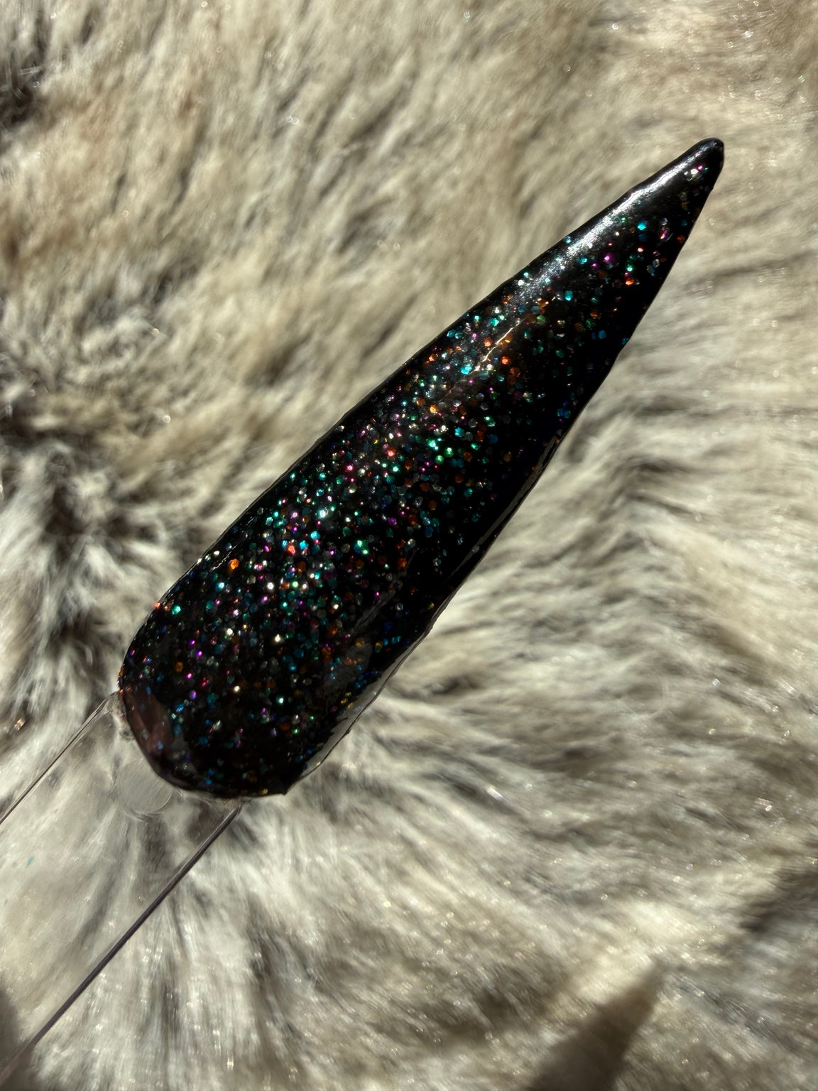 Colour Me Trouble dark base with fine multicolour glitter swatch