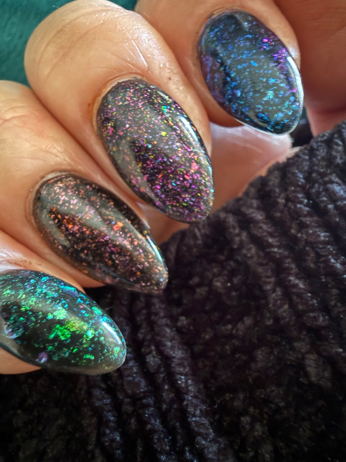Black chameleon flake manicure featuring Envy Me, natural-light view 5