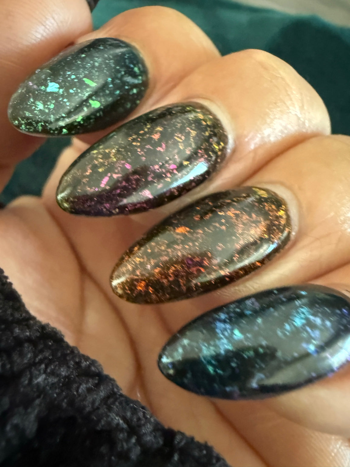 Black chameleon flake manicure featuring Zero Regrets, natural-light view 6