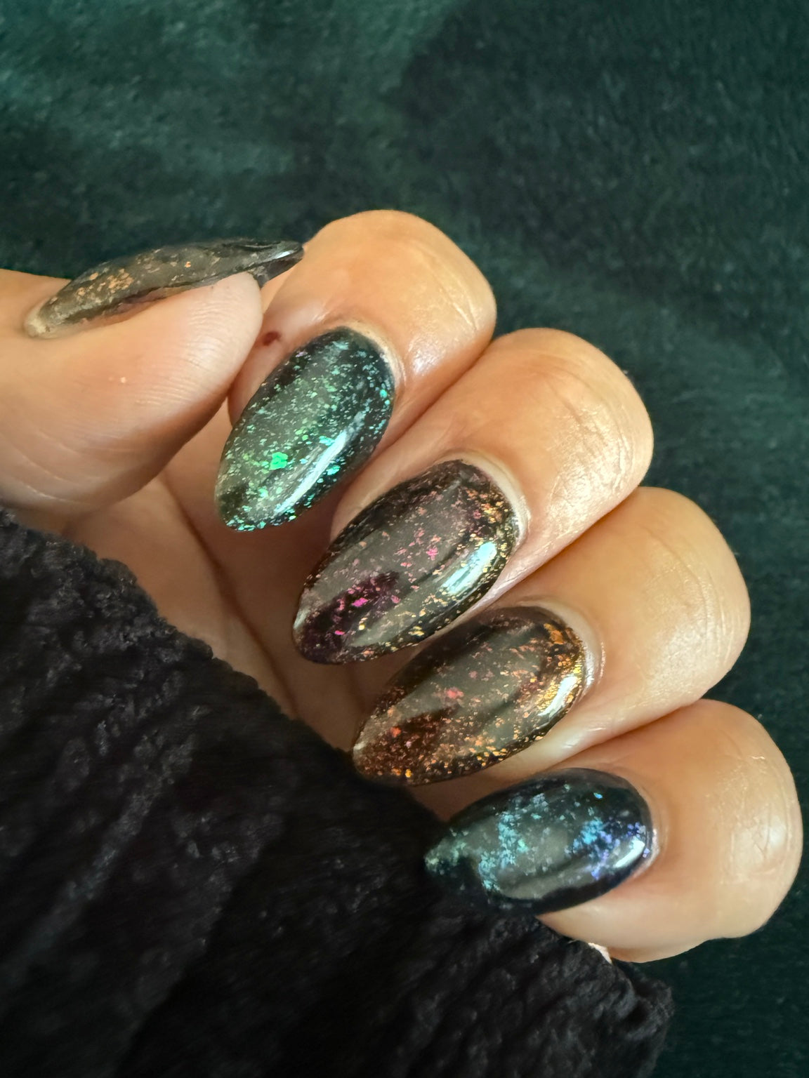 Black chameleon flake manicure featuring Zero Regrets, natural-light view 7