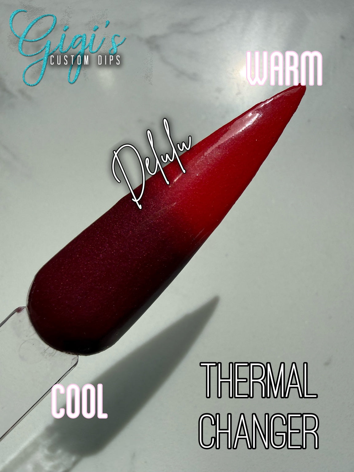 Labeled Delulu thermal dip powder swatch showing cool deep burgundy and warm bright red
