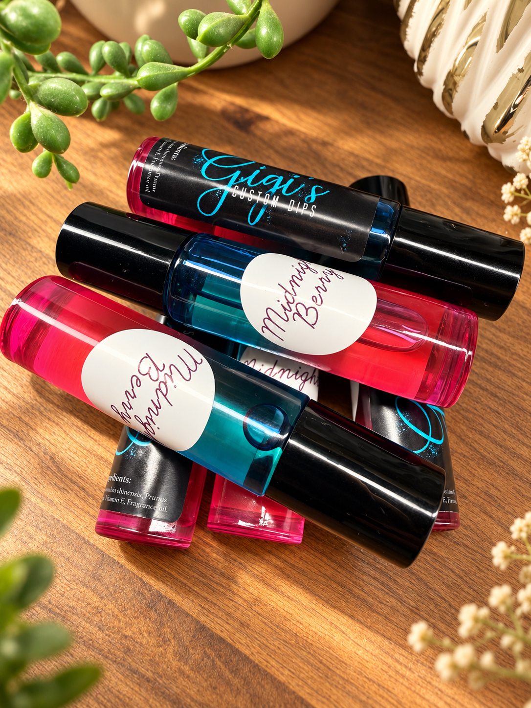 Midnight Berry cuticle oil collection, styled product photo
