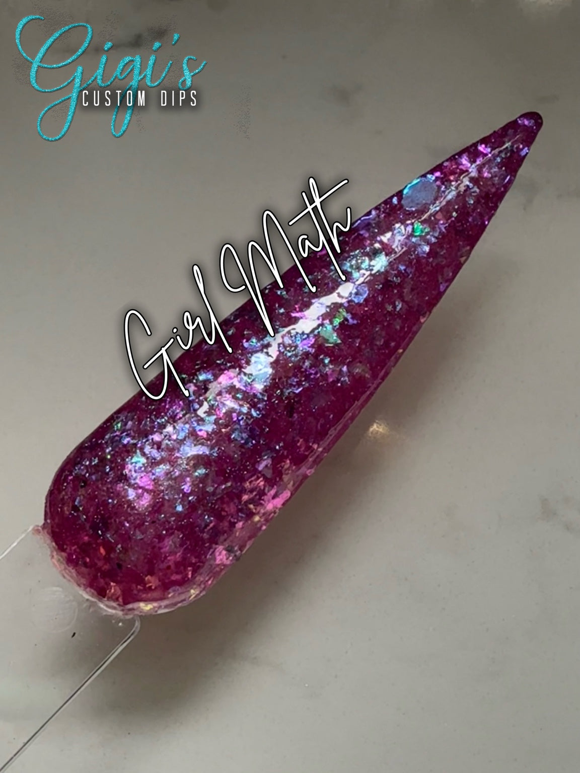 Labeled Girl Math magenta dip powder swatch with fuchsia, violet, aqua, teal and icy blue iridescent flakes