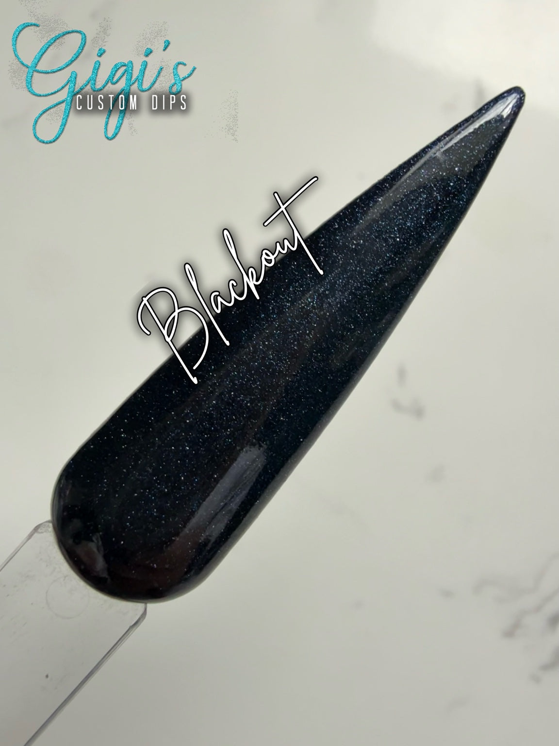 Blackout black with a fine shimmer dip powder swatch