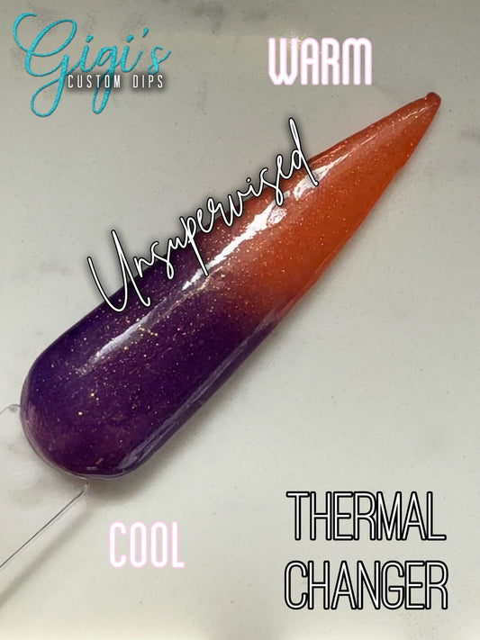 Labeled Unsupervised thermal dip powder swatch showing cool rich purple and warm coral peach with golden shimmer