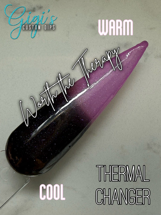 Labeled Worth the Therapy thermal dip powder swatch showing cool near-black plum and warm lilac pink