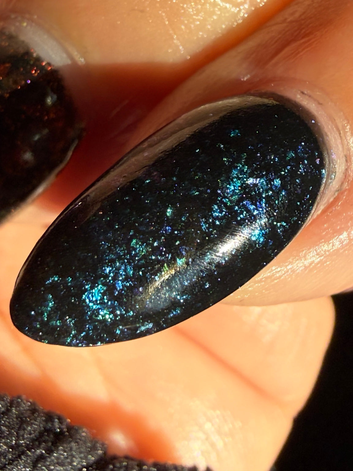Zero Regrets blue chameleon flake dip powder manicure close-up